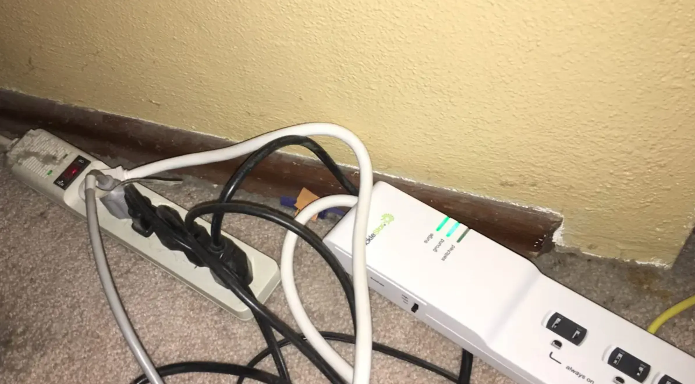 A tangle of daisy-chained power strips and cables